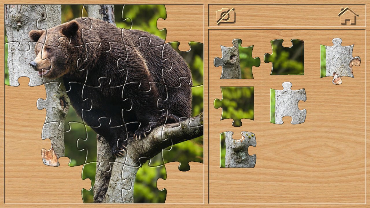 Układanie puzzli z niedźwiedziem na drzewie